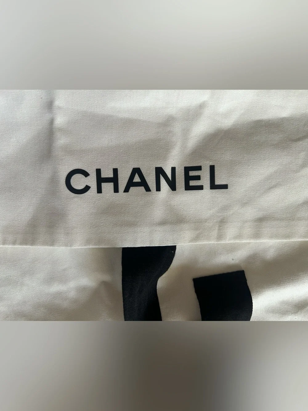 CHANEL White Dust Bag with Black Logo and Tie